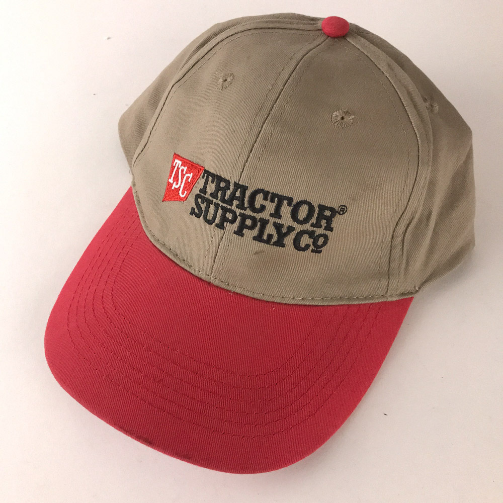 Classic Tractor Supply Co hat beige top with red brim